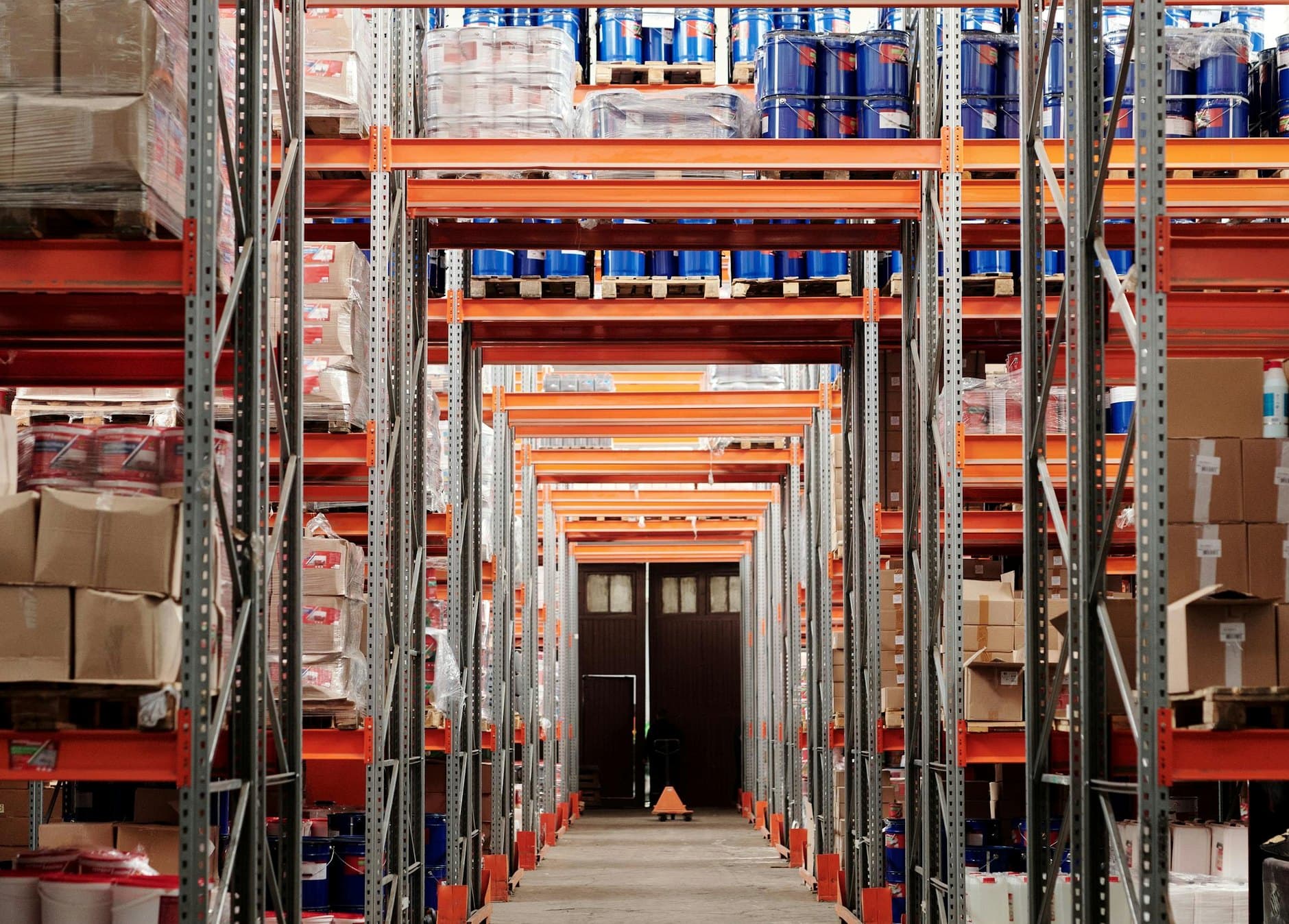 Palletized wholesale inventory at a third-party distribution facility, representative of stock-lot categories SS Trading brokers